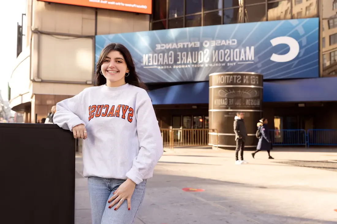 Person standing outside Madison Square Garden.